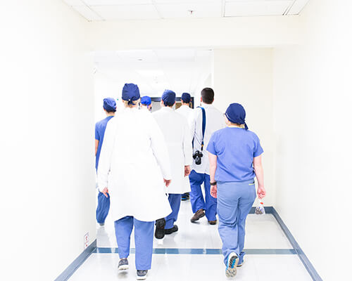 Group of doctors and nurses walking