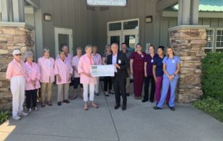 Auxiliary donating a check to Seneca Healthcare District for equipment purchase